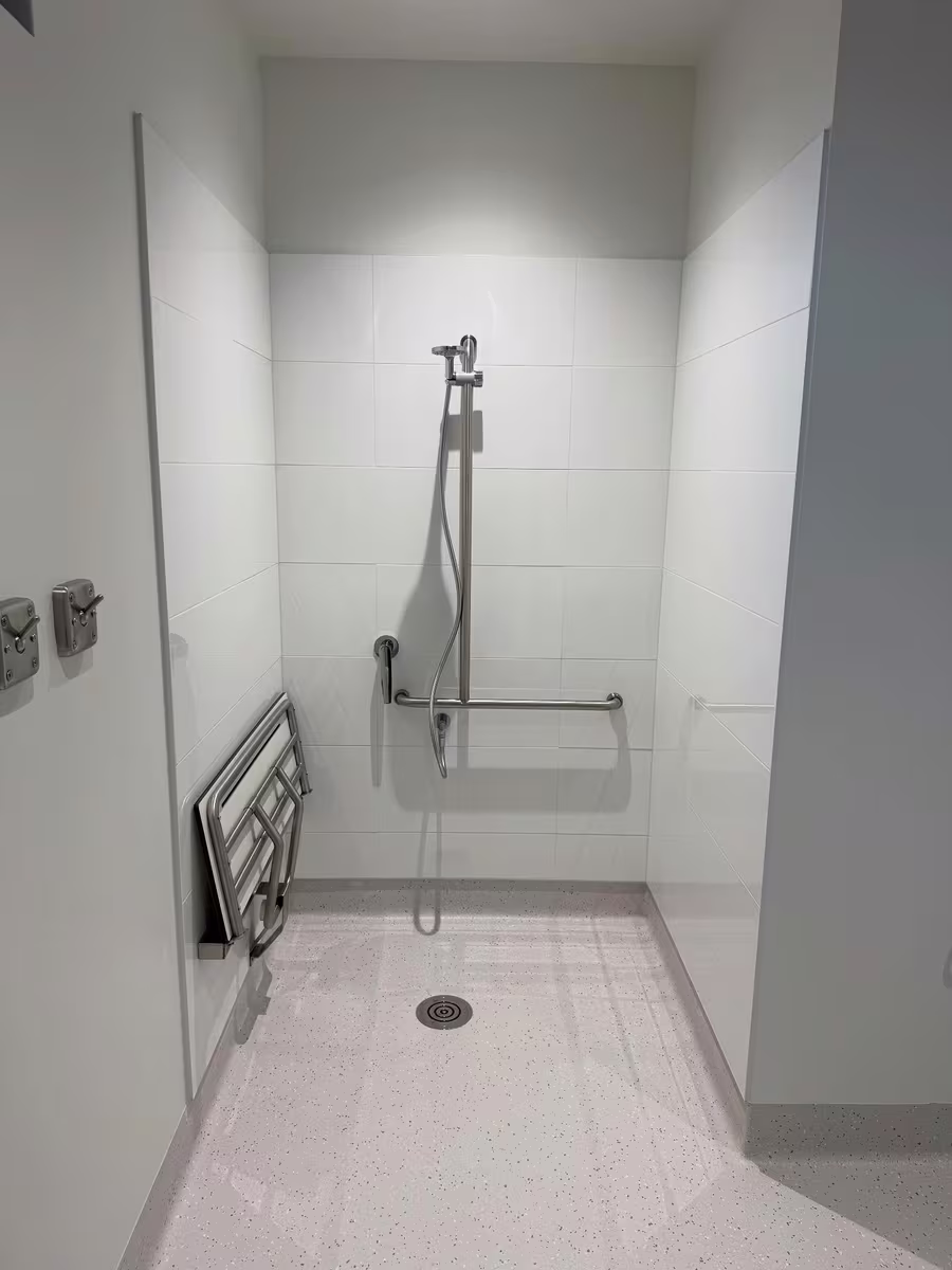 Accessible shower cleaned back to a spotless finish before handover