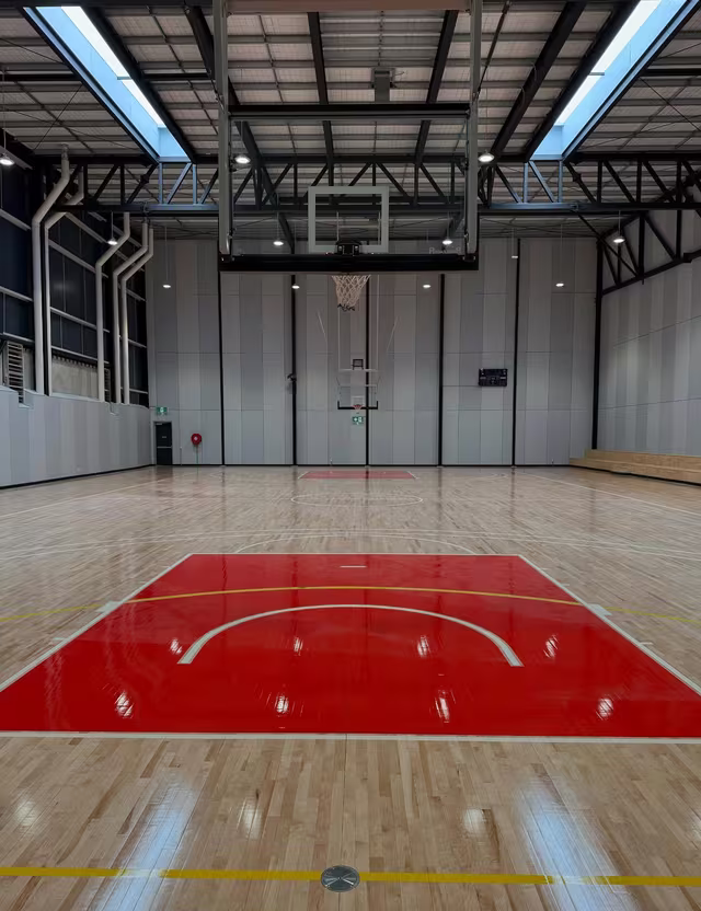 Polished timber sports floor cleaned by Tier1Clean
